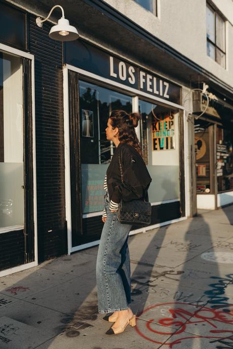 Bomber jacket Sara from Collage Vintage wearing a bomber jacket and a striped tee shirt