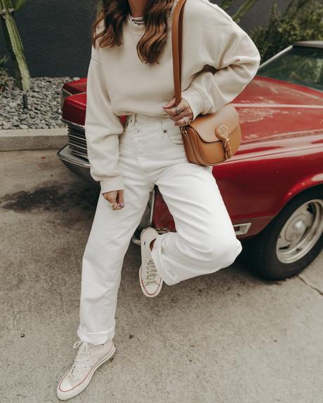 Sara from Collage Vintage wearing Agolde white jeans, Dior denim bucket hat and Converse All-Star