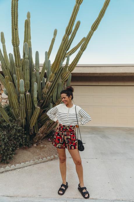 Sara from Collage Vintage wearing Sézane jacquard multicolor shorts and striped jumper and Chanel dad leather sandals