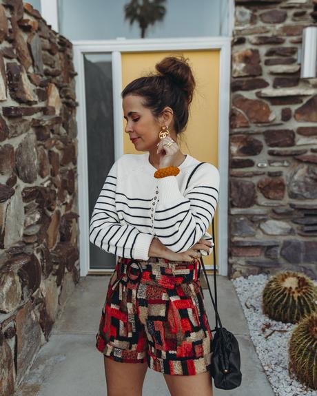 Sara from Collage Vintage wearing Sézane jacquard multicolor shorts and striped jumper and Chanel dad leather sandals