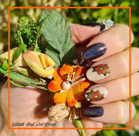 Manicura con holográfico negro y flores naranja