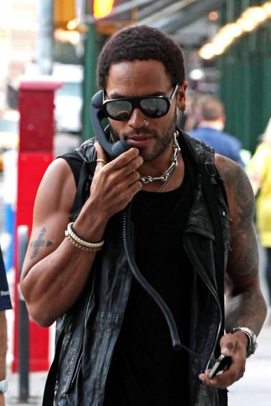 Lenny Kravitz Lenny Kravitz talks into a vintage looking iPhone attachment as he goes for a walk in SoHo.