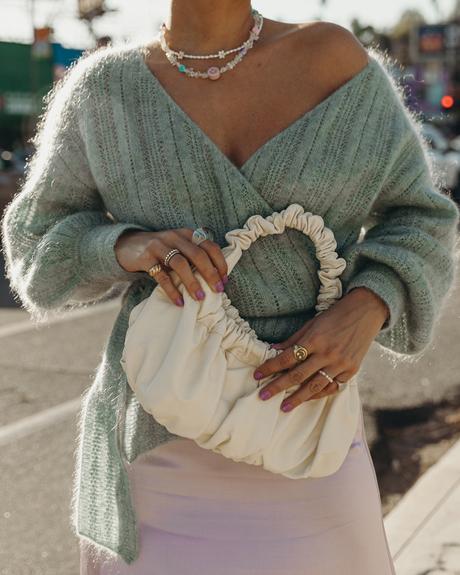 Sara from Collage Vintage wearing a Sézane lavender midi skirt and a mint knit-sweater