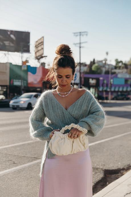 Sara from Collage Vintage wearing a Sézane lavender midi skirt and a mint knit-sweater