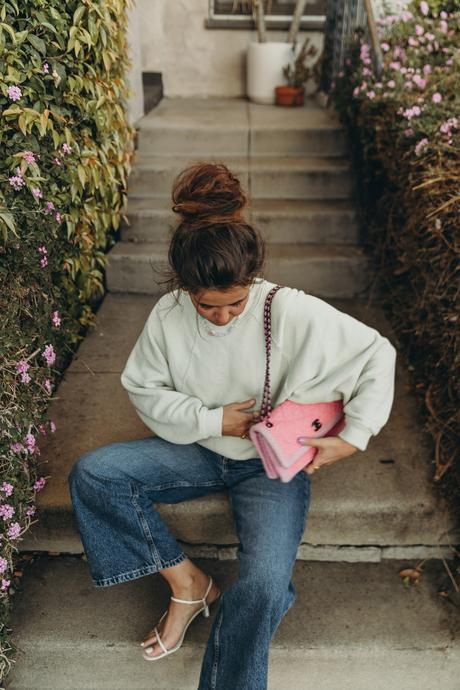 Sara from Collage Vintage wearing H&M sweatshirt, Zara cropped wide-leg jeans and Chanel vintage bag