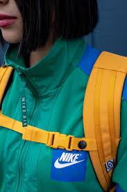 Wallpaper engine enables you to use live wallpapers on your windows desktop. Hd Wallpaper Woman Wearing Green Nike Zip Top And Yellow Backpack Adult Brand Trademark Wallpaper Flare