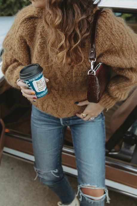 Morning coffee Sara is wearing Isabel Marant camel knit sweater, Moussy Vintage tapered jeans, By Far leather bag and All-Star retro sneakers