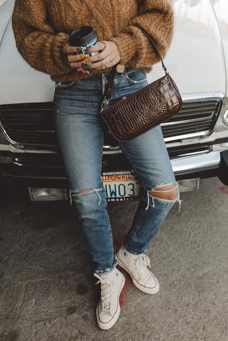 Morning coffee Sara is wearing Isabel Marant camel knit sweater, Moussy Vintage tapered jeans, By Far leather bag and All-Star retro sneakers