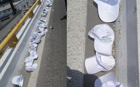 Gorras con logo de Octavio Pedroza quedan regadas en la Carretera Matehuala