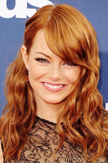 Emma Stone photographed on the red carpet at the 2011 MTV Movie Awards in Los Angeles.