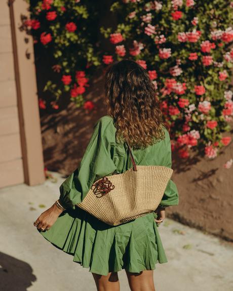 Sara from Collage Vintage wearing a Rhode green summer dress, espadrilles and a Loewe basket bag