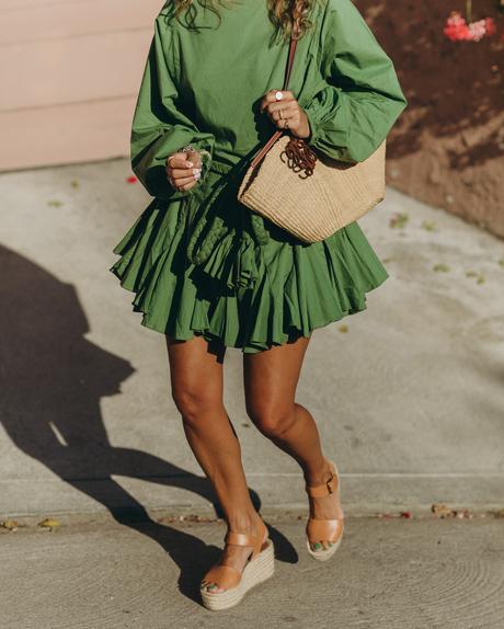Sara from Collage Vintage wearing a Rhode green summer dress, espadrilles and a Loewe basket bag