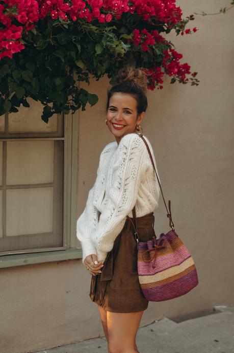 Sara from Collage Vintage wearing the new Sézane fall-winter collection. Wearing a wool cardigan, suede skirt and mid-heel pumps