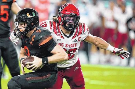 # 18 Wolfpack cut by Miami 31-30 # 18 Wolfpack cut by Miami 31-30