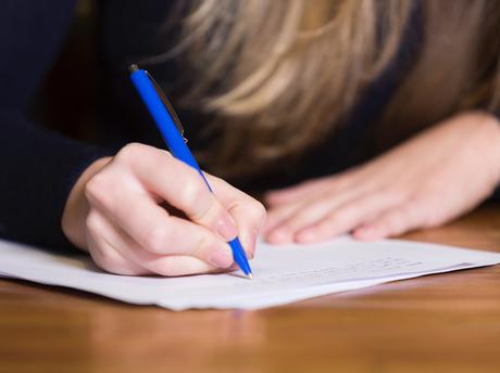 Parent picks up correction pen for letter full of mistakes from teachers’ union