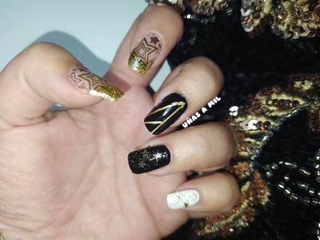 Diseño de uñas en negro y dorado para Nochevieja, Año Nuevo o Navidad