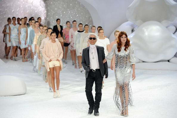 Karl Lagerfeld and models acknowledge the applause of the audience after the Chanel Ready to Wear Spring / Summer 2012 show during Paris Fashion Week at Grand Palais on October 4, 2011 in Paris, France.