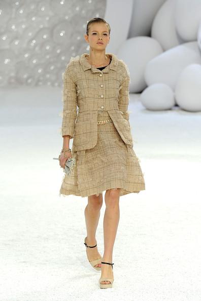 A model walks the runway during the Chanel Ready to Wear Spring / Summer 2012 show during Paris Fashion Week at Grand Palais on October 4, 2011 in Paris, France.