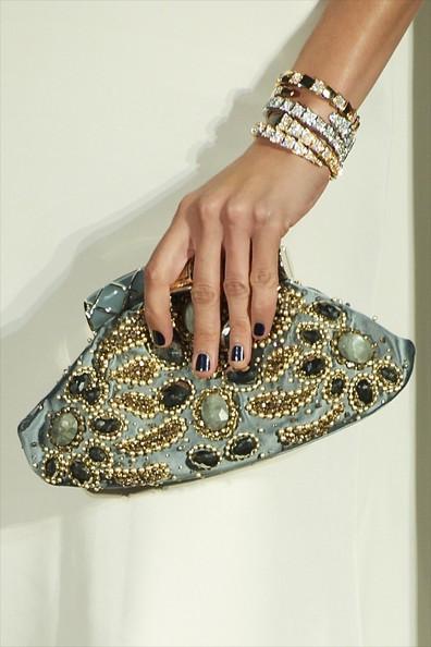 Spanish model Nieves Alvarez (handbag and jewelry detail) attends 
