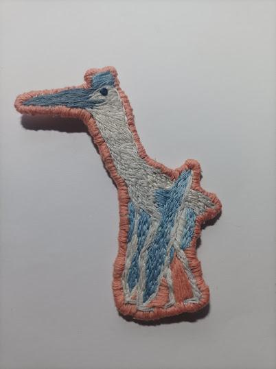 Los bordados dinosaurianos de Small Microraptor