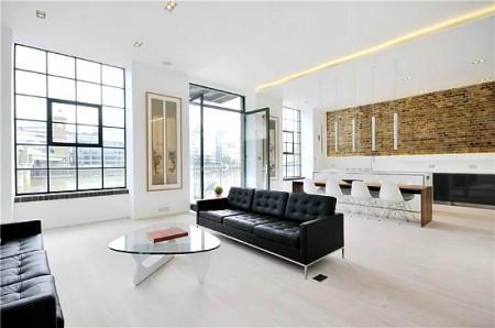 sillas eames muro caravista muebles de diseño grandes ventanales estilo nórdico estilo minimalista estilo londinense entrevisa decoesfera delikatissen diseño de interiores decoración en blanco decoración de interiores cocina moderna cocina blanca cama tatami apartamento de diseño en londres 