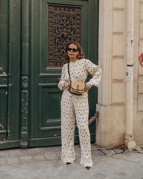 Sara from Collage Vintage at Saint Germain Paris wearing a Sézane polka dots set and a leather crossbody bag.