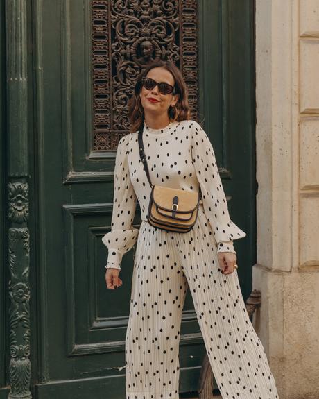 Polka dots set Sara from Collage Vintage at Saint Germain Paris wearing a Sézane polka dots set and a leather crossbody bag.