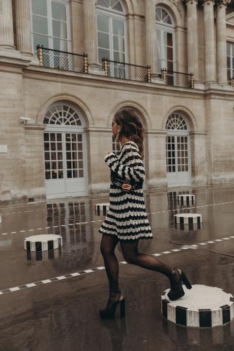 Sara from Collage Vintage at Paris Fashion Week. Wearing a striped knit long sweater, Fendi vintage bag and platform sandals.