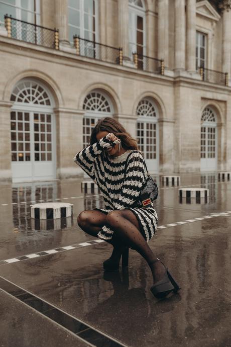 Sara from Collage Vintage at Paris Fashion Week. Wearing a striped knit long sweater, Fendi vintage bag and platform sandals.