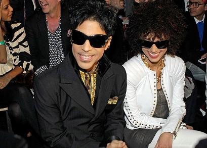 Prince takes his seat for the Versace for H&M fashion show.