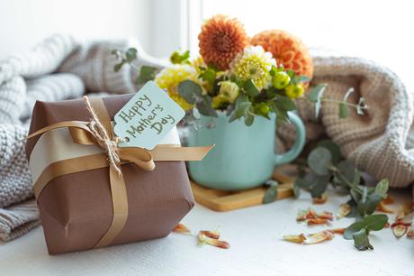 Festive composition for mother's day with gift box and flowers.
