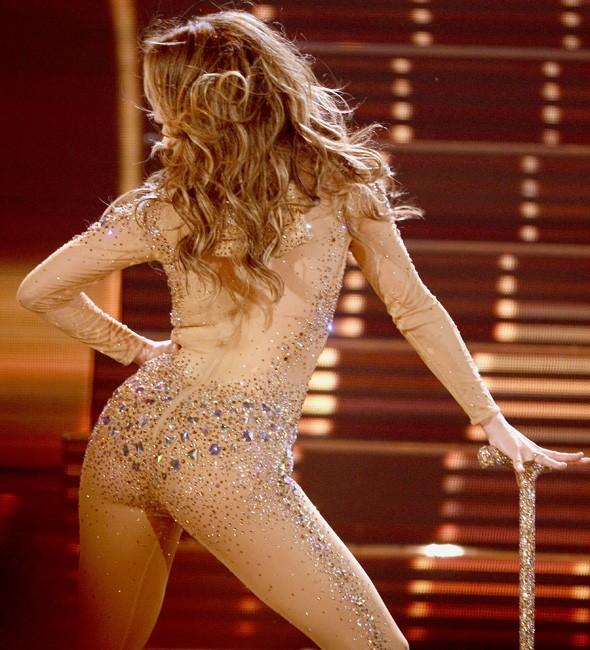 Nearly nude: Jennifer Lopez steals the show at AMAs in flesh crystal body suit