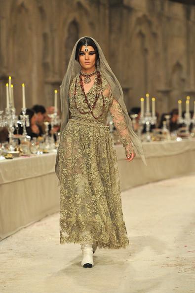 A model walks down the runway during the Chanel Paris-Bombay Show at Grand Palais on December 6, 2011 in Paris, France.