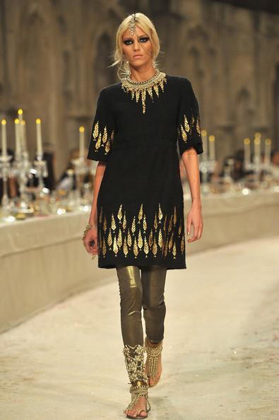 Model Anja Rubik walks down the runway during the Chanel Paris-Bombay Show at Grand Palais on December 6, 2011 in Paris, France.