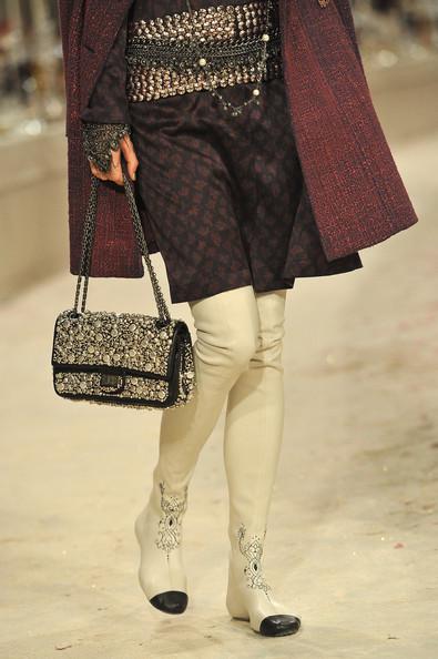 A detail of a model is seen as she walks the runway during the Chanel Paris-Bombay Show at Grand Palais on December 6, 2011 in Paris, France.