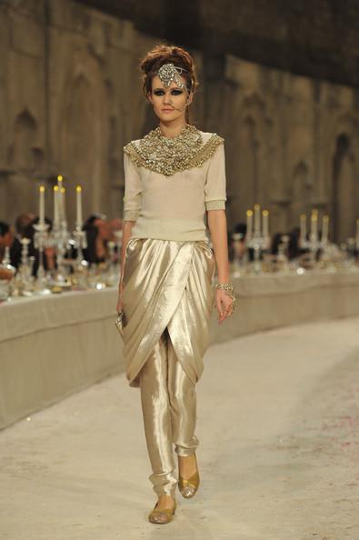 A model walks down the runway during the Chanel Paris-Bombay Show at Grand Palais on December 6, 2011 in Paris, France.