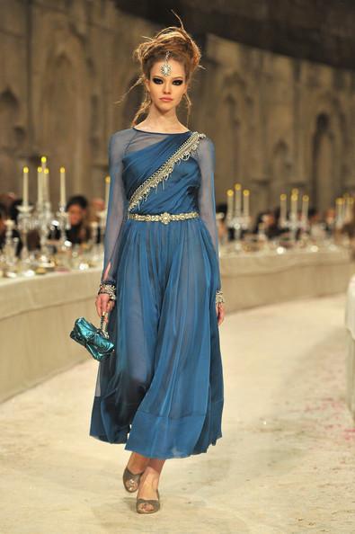 A model walks down the runway during the Chanel Paris-Bombay Show at Grand Palais on December 6, 2011 in Paris, France.