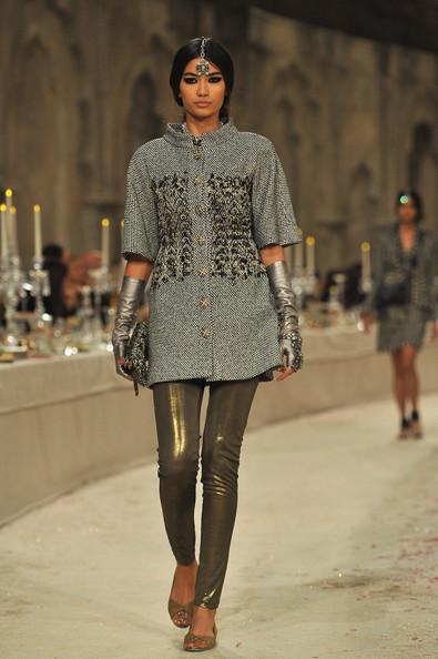A model walks down the runway during the Chanel Paris-Bombay Show at Grand Palais on December 6, 2011 in Paris, France.