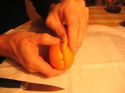 Vela decorativa con una mandarina