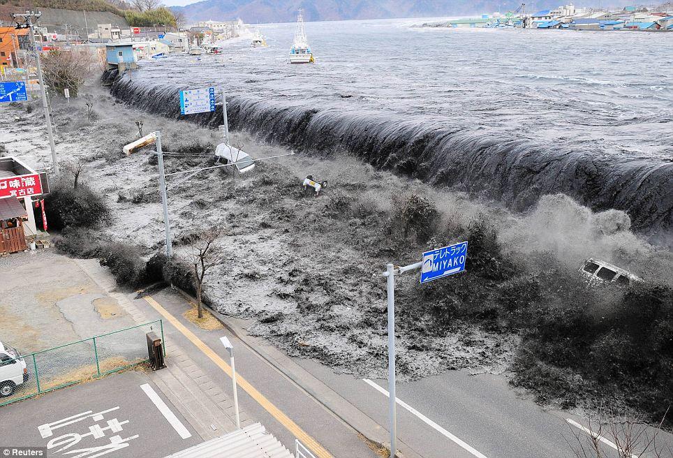 DEVASTATION: A wave caused by a tsunami flows into the city of Miyako on March 11 after the magnitude 8.9 earthquake struck the area 