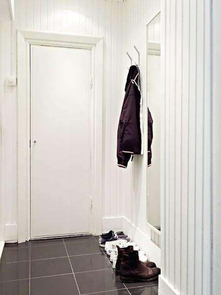 Un rectángulo de estilo nórdico de 66m² suelo de madera oscura pisos pequeños estilo nórdico muebles de ikea muebles blancos espacios diáfanos diseño de interiores decoración pisos pequeños decoración estilo nórdico decoración en blanco decoración de interiores casa rectangular