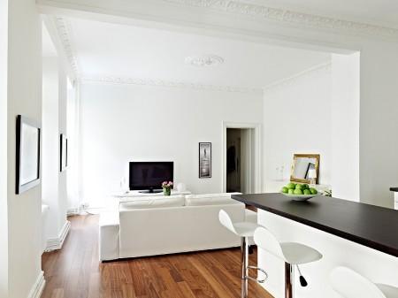 Un rectángulo de estilo nórdico de 66m² suelo de madera oscura pisos pequeños estilo nórdico muebles de ikea muebles blancos espacios diáfanos diseño de interiores decoración pisos pequeños decoración estilo nórdico decoración en blanco decoración de interiores casa rectangular