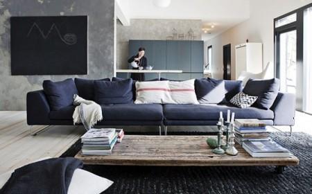 una villa de lujo en suecia sillas easmes sillas eames sillas de diseño rústico moderneo rustico minimalista paredes de cemento muebles de diseño madera estilo nórdico estilo escandinavo espacios diáfanos diseño nórdico decoración en gris decoración de interiores cocina de diseño casa de campo sueca blanco y negro 