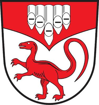 Escudos y banderas dinosaurianas