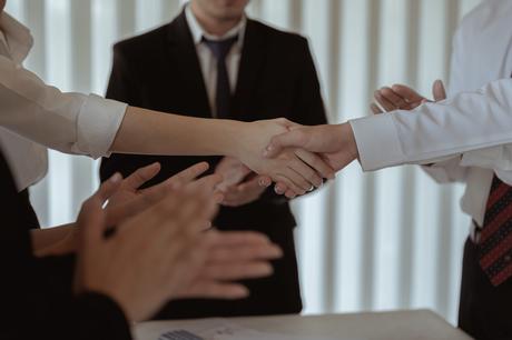 shaking hands happy to be promot3 scaled