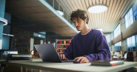 Student,Studying,In,A,Modern,Library.,Young,Man,Thinking,And