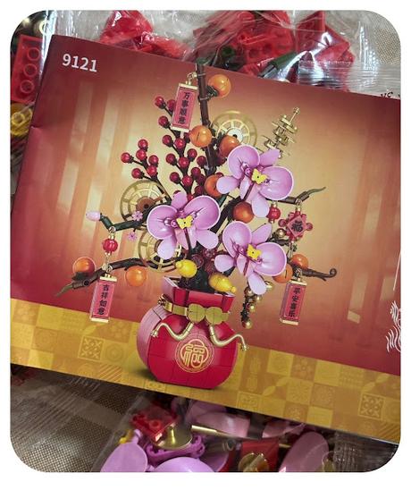 Ruyi de caqui con orquĂ­deas y flores de durazno