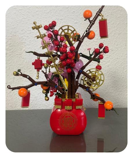 Ruyi de caqui con orquĂ­deas y flores de durazno