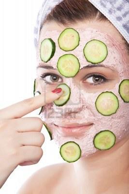 Skincare woman with beauty mask of fresh cucumbers. Arm applying  Stock Photo - 11812229