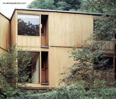 Casa cubo moderna de madera y piedra.